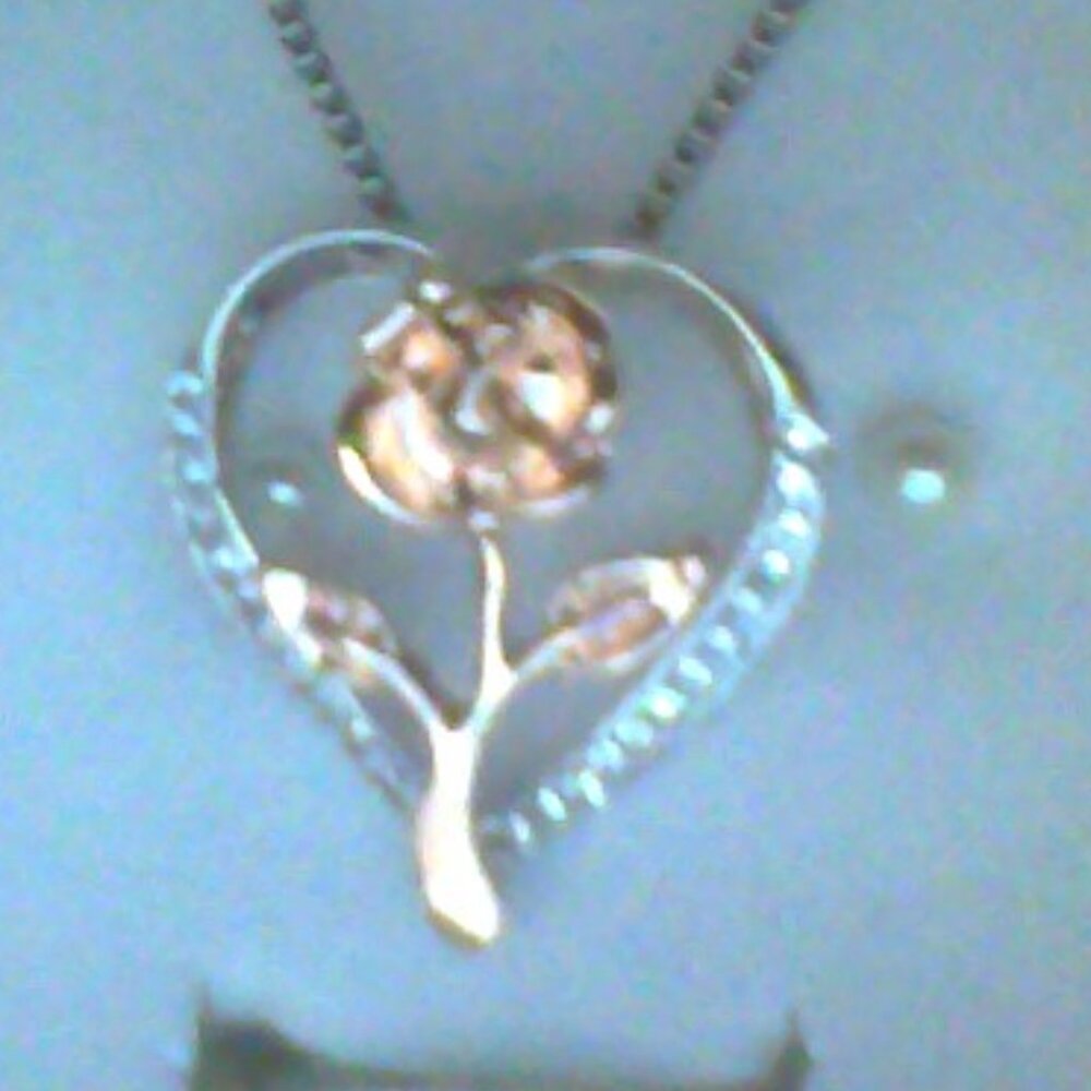 silver pendant and necklace with diamond chips and rose gold plated rose